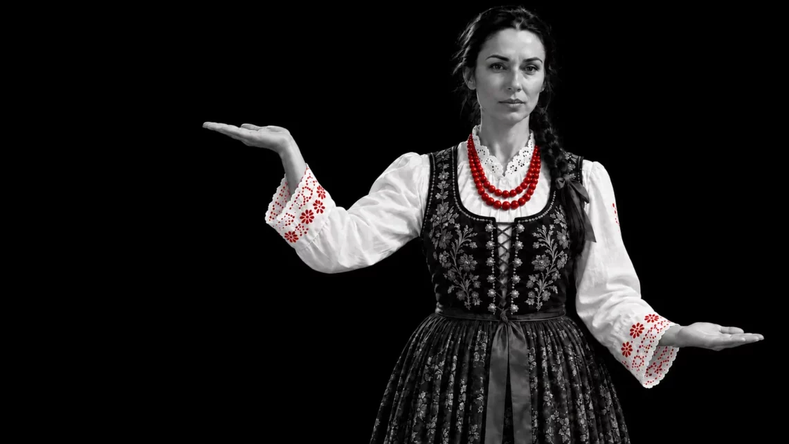 Woman in Polish folk costume illustrating Poland’s Moody’s credit rating downgrade from A2 to A3